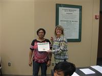 Ruthie Romero, first grade teacher at Johnston-McQueen Elementary School, received $1,773.73 from Kim Holcomb, Foundation president, for her grant titled "It's All About That Science."